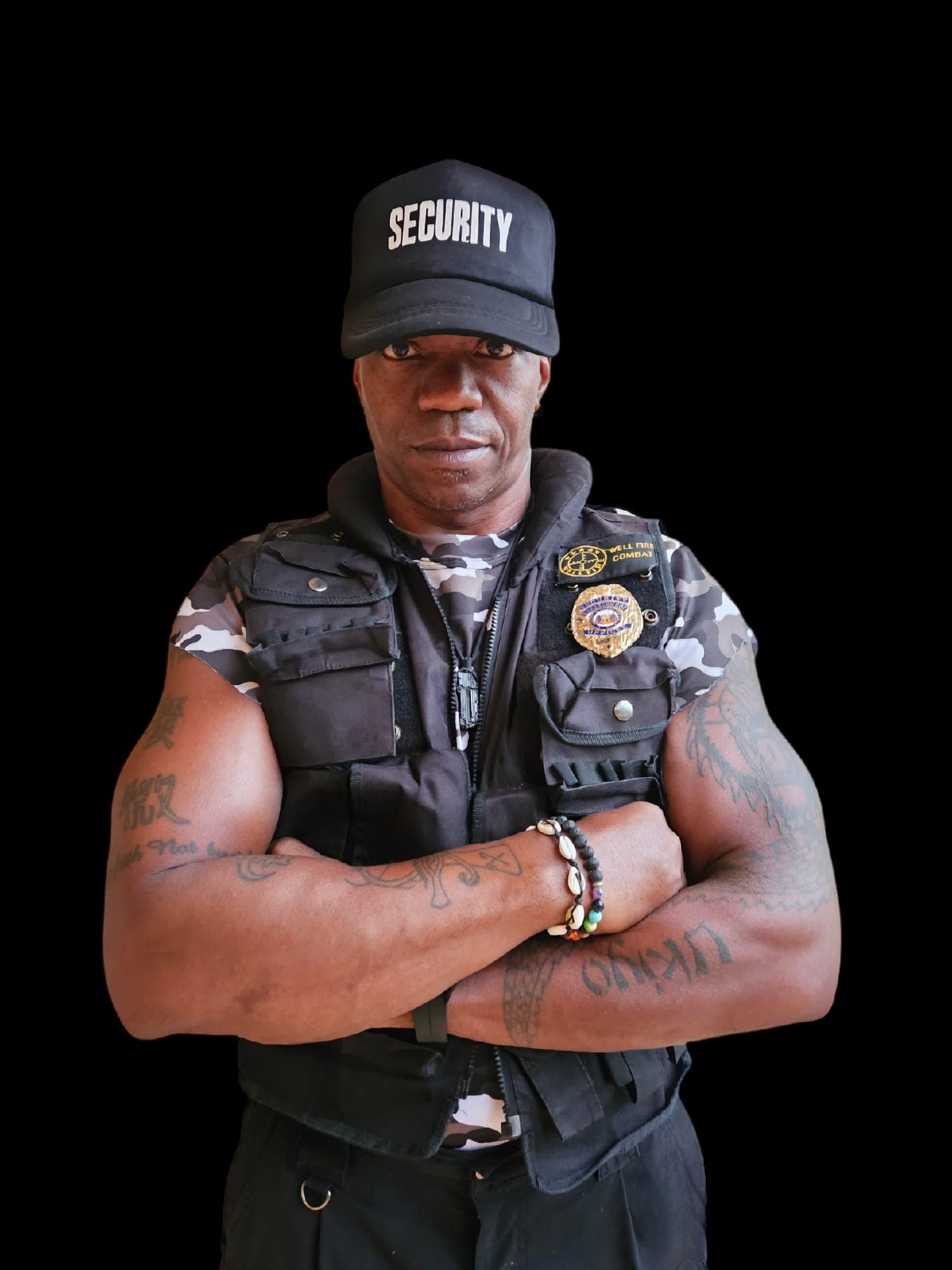 Professional ONYX Protection Services security guard - muscular Black male in tactical vest
